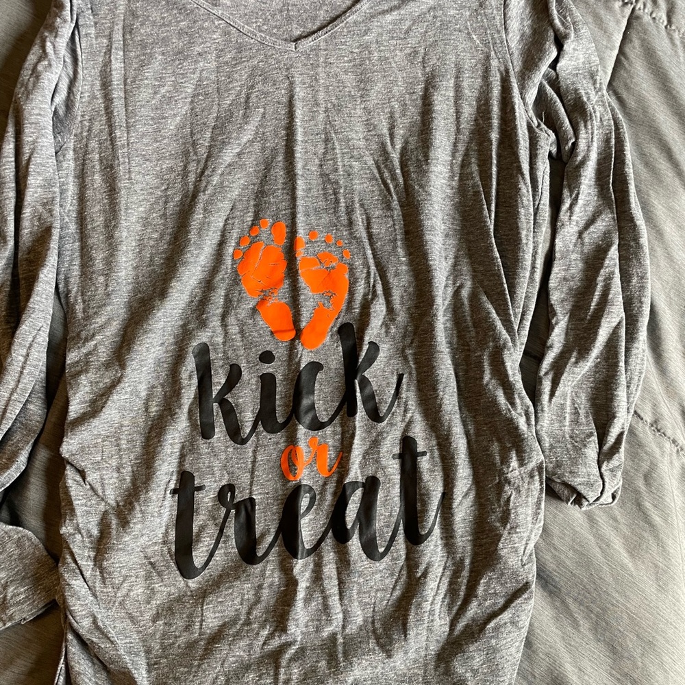 Kick or treat v neck maternity shirt.